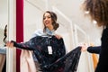 Two young women trying out new clothes in the cabin Royalty Free Stock Photo