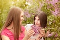 Two young women walking outside in a park Royalty Free Stock Photo