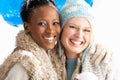 Two Young Women Wearing Warm Winter Clothes