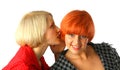 Two young women whispering and surprised Royalty Free Stock Photo