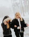 Two young women in a winter park