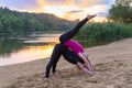 Two young women working out on a sunset beach