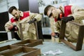 Two young workers assembling furniture in the factory Royalty Free Stock Photo