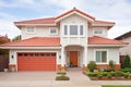 twostory mediterranean house with red tiled roof