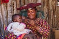 Twyfelfontein, Namibia - Jul 10, 2019: Herero Woman in traditional clothes in Twyfelfontein. Namibia