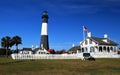 Tybee Island Light Station with the American Flag in the foreground Royalty Free Stock Photo