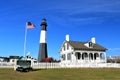 Tybee Island Light Station with the American Flag in the foreground Royalty Free Stock Photo