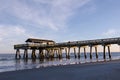 Tybee Island pier in Southern Georgia United States on the beach of the Atlantic Ocean, golden hour Royalty Free Stock Photo