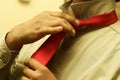 Tying a Red Tie Royalty Free Stock Photo