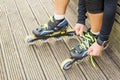 Tying roller skates Royalty Free Stock Photo