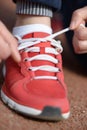 Tying sports shoe