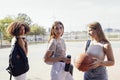 tylish cool teen girls gathering at basketball court, friends ready for playing basketball outdoors