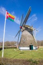 Tynaarlo flag in front of the historic windmill in Oudemolen Royalty Free Stock Photo