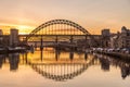 The Tyne Bridge at sunset, reflecting in the almost still River Tyne beneath Royalty Free Stock Photo