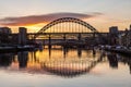 The Tyne Bridge at sunset, reflecting in the almost still River Tyne beneath Royalty Free Stock Photo