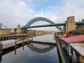 Tyne bridge reflects in a calm river at Newcastle quayside Royalty Free Stock Photo