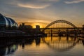 The Tyne Bridge at sunset, reflecting in the almost still River Tyne beneath Royalty Free Stock Photo