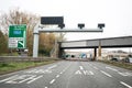 Approach to Tyne Tunnel Toll Road on A19 showing signs and entrance in distance Royalty Free Stock Photo