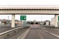 Approach to Tyne Tunnel Toll Road on A19 showing signs and entrance in distance Royalty Free Stock Photo