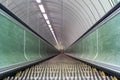 View down wooden escalattor in tunnel leading underground