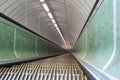View down wooden escalattor in tunnel leading underground