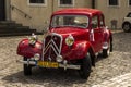 Tyniec, Krakow, Poland, August 3, 2019: Old, antique red car used to transport newlyweds at the wedding