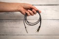 3 In 1 Type-C3.5mm Jack Aux Cable in hand. White background Royalty Free Stock Photo