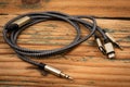 3 In 1 Type-C3.5mm Jack Aux Cable on a wooden texture background. Object Royalty Free Stock Photo