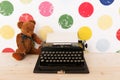 Type writer and vintage bear