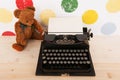 Type writer and vintage bear