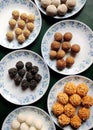 Types of Assamese desserts prepared during Bihu festival.