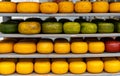 types of cheese in a wooden shelf