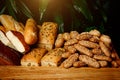 Types of homemade bread in a rustic wooden basket. Royalty Free Stock Photo