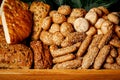 Types of homemade bread in a rustic wooden basket. Royalty Free Stock Photo