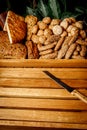 Types of homemade bread in a rustic wooden basket. Royalty Free Stock Photo