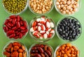 Collection of legumes in the cup isolated on green background