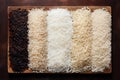 types of rice white black red on wooden background