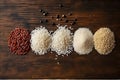 types of rice white black red on wooden background