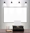 Typewriter and blank placard on wall Royalty Free Stock Photo