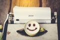 Typewriter with happy face coffee cup with blurry message 2018, Royalty Free Stock Photo