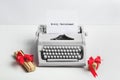 Typewriter with MERRY CHRISTMAS text and gifts