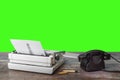 Typewriter, old telephone, ink pen and notepad on a textured table. Green screen. Chroma Key Royalty Free Stock Photo