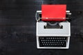 Typewriter and red paper