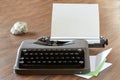 Typewriter on a table with letterhead paper