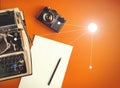 Typewriter, Vintage Film Camera, Sheet Of Paper And Pencil On A Yellow Background, Top View With Sunshine. Creative writing concep Royalty Free Stock Photo