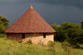 Typical African building against dark sky