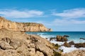 Typical Algarvian landscape with limestone cliffs and turquoise water. Praia do Porto de Mos, Lagos