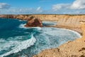 Typical Algarvian scene with limestone rocks washed by the Atlantic Ocean. Carrapateira, Portugal