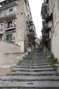 Typical alley with staircase paved with lava stones