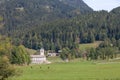 Typical alpine catholic church in Zgornje Jezersko, in Slovenia, at the border with Austria, in the julian alps mountain Royalty Free Stock Photo